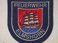 Das Abzeichen der Freiwilligen Feuerwehr Elmshorn zeigt die Flora,  ein dreimastiges Segelschiff.